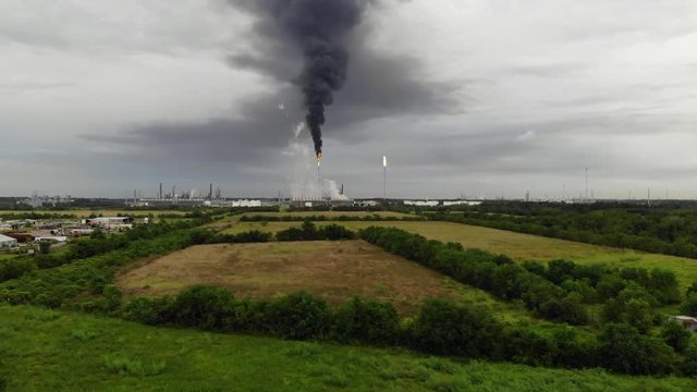 Chemical Plant Conducting Controlled Flaring to Burn Off Excess Materials in Channelview near Houston, Texas Filmed by Drone