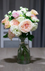 Interior. Bouquet roses on the kitchen table