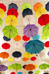 Fototapeta na wymiar different colors umbrellas as a background