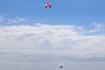 kitesurfer jumping on his board