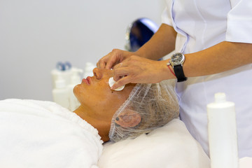 Patient and cosmetologist during cosmetic procedures in the clinic. Cosmetology