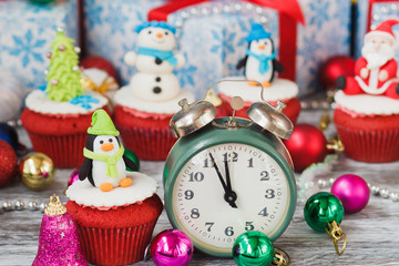 Fototapeta na wymiar Christmas cupcake with colored decorations, soft focus background