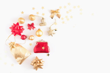 Christmas composition. Christmas golden and red decorations, pine cone, star, gift, balls on white background. Flat lay, top view, copy space 