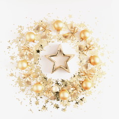 Fototapeta na wymiar Christmas composition. Christmas gold wreath of golden sequins and decorations on white background. Flat lay, top view, copy space 