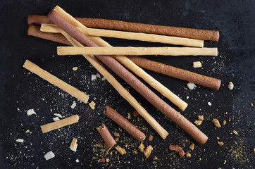 Rye and wheat breadsticks on black