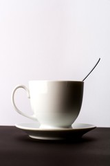Cup of Drink with Spoon on the Table