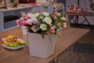 White and pink white flower square basket .