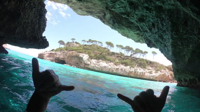 Swimming tropical ocean cave, POV