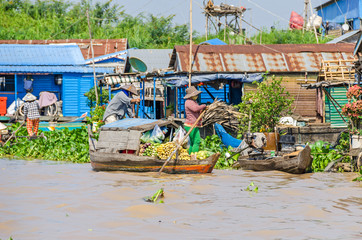 Fototapeta na wymiar Floating village and floating market on the Tonle Sap Lake in Cambodia