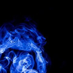 Blue smoke on black background