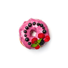 Donut with pink cream and berries, isolated on white background. Top view.