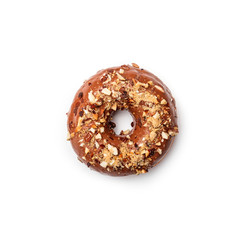 Donut with chocolate glaze with milk and peanuts, isolated on white background. Top view.