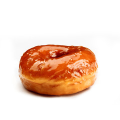 Donut glazed with caramel, isolated on white background. View from side.
