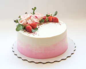 Biscuit cake with berries and flowers
