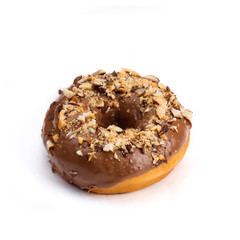 Donut with chocolate glaze with milk and peanuts, isolated on white background. Viewing forty-five degrees.