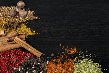 Spices on a dark brown wooden table