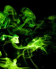 Green smoke on black background