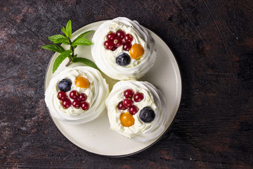 Delicious mini Pavlova meringue cake with berries
