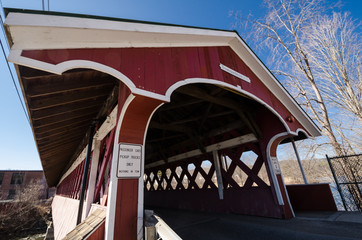 Artistic angle of the Denman Thompson Bridge in West Swanzey New Hampshire is a two span town lattice truss bridge that crosses the Ashuelot River