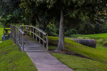 Fototapeta na wymiar old wooden bridge in the park