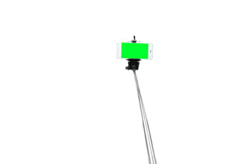 Selfie stick and smartphone on an isolated white background