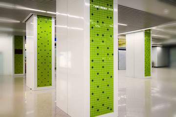 Geometric mosaic pattern on pillar in subway station channel