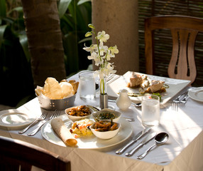 Southern indian, vegitarian, ayurvedic gourmet table for two in restaurant with natural light