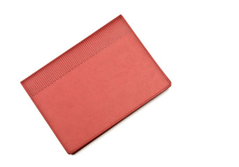 Red notebook on white background.