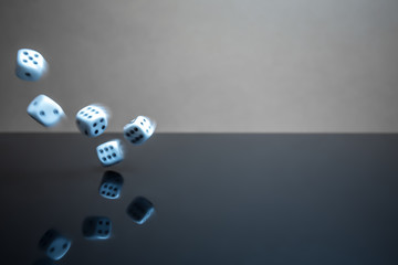 Floating, flying dice on a reflective surface - 226879429