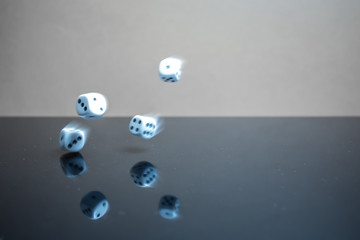 Flying, floating dice on a reflective background - 226879871