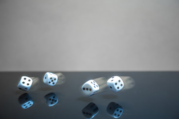 Flying, floating dice on a reflective background - 226880050