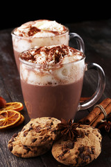 Hot chocolate cocoa with whipped cream on table.