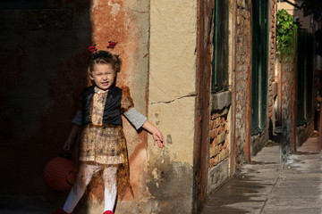 Little girl dressed up for Halloween in Venice Italy 