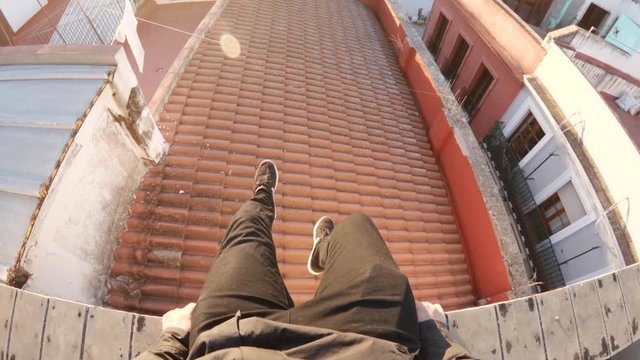 Tilt up POV, sitting on rooftop in Seville