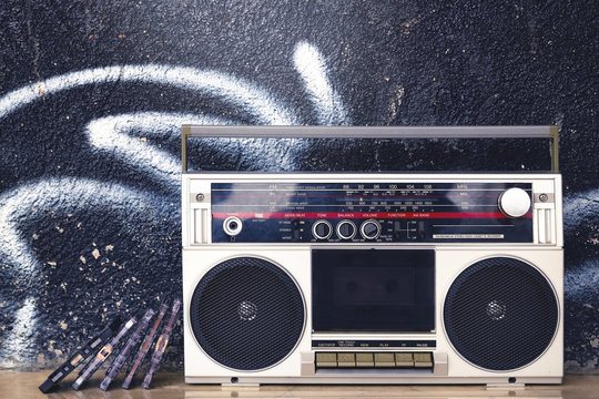 Vintage Boombox Radio With Cassettes On A Graffiti Background