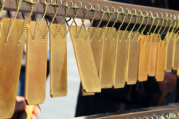 An unusual musical instrument - the duration or flat bells. Copper plates. Selective focus, side...