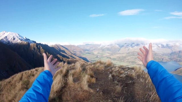 POV, hiking on mountain peak in Wanaka