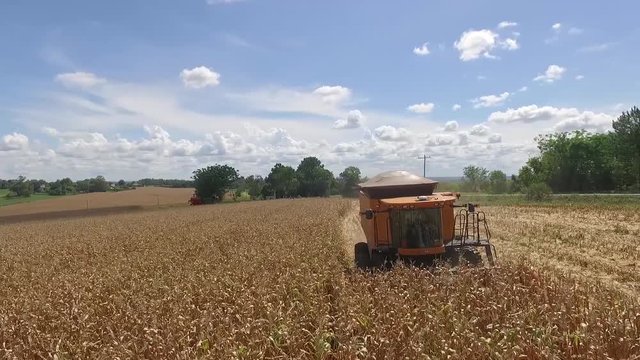 Tractor harvesting large aerial farm