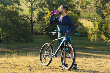 Fototapeta premium Cyclist in shorts and jersey on a modern carbon hardtail bike with an air suspension fork 