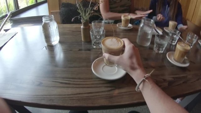 Drinking lattes in Queenstown cafe, POV