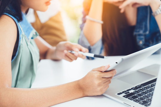 Business meeting, Young coworker woman making business discussion in modern office. Teamwork people concept. Casual businesswoman crew working new startup project on laptop and tablet. Presentation