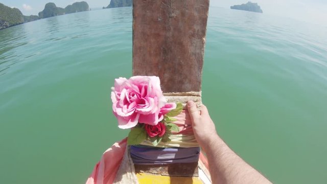 POV, flowers on bow of boat