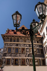 sgraffito on front facade of building - with lantern