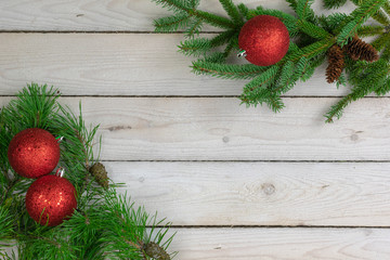 Holiday border of greenery in the upper right and lower left corners with copy space