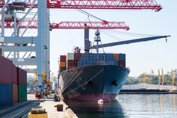 Panamax Container ship in port at container terminal. Ships of container ships stand in terminal of...