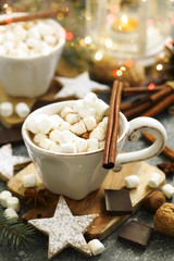 Hot chocolates with marshmallows and Christmas cookies