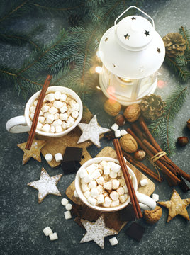 Hot chocolates with marshmallows and Christmas cookies