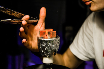 Hot coals for Smoking hookah. Bowl with tobacco and coal.	