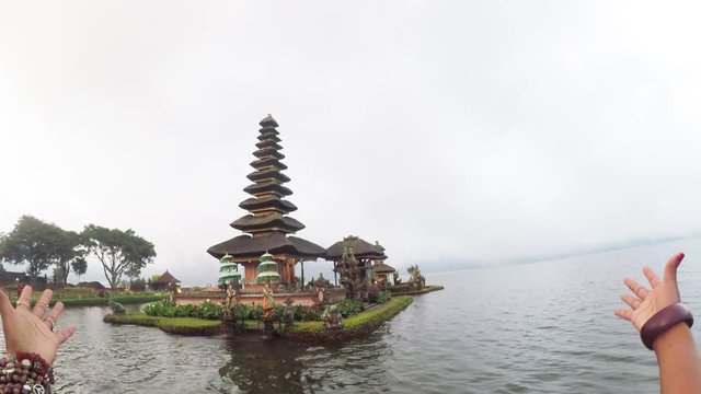 Walking past scenic architecture eon lake, tilt up POV