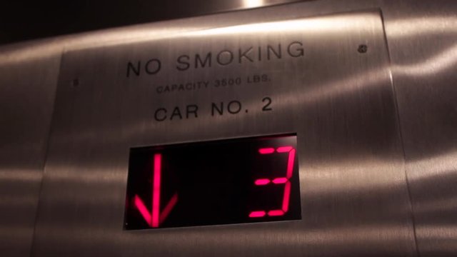 Elevator red numbers counting down from 4